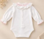 Body cuello volante detalle rosa