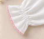 Body cuello volante detalle rosa